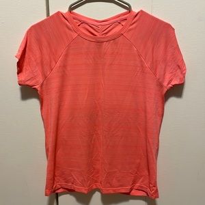 Athleta Girl T Shirt with ruching in the back.  Coral color, size XL (14)